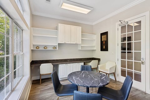 a dining room with a table and chairs